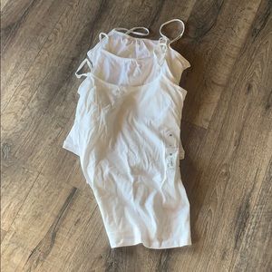 3 white tank tops